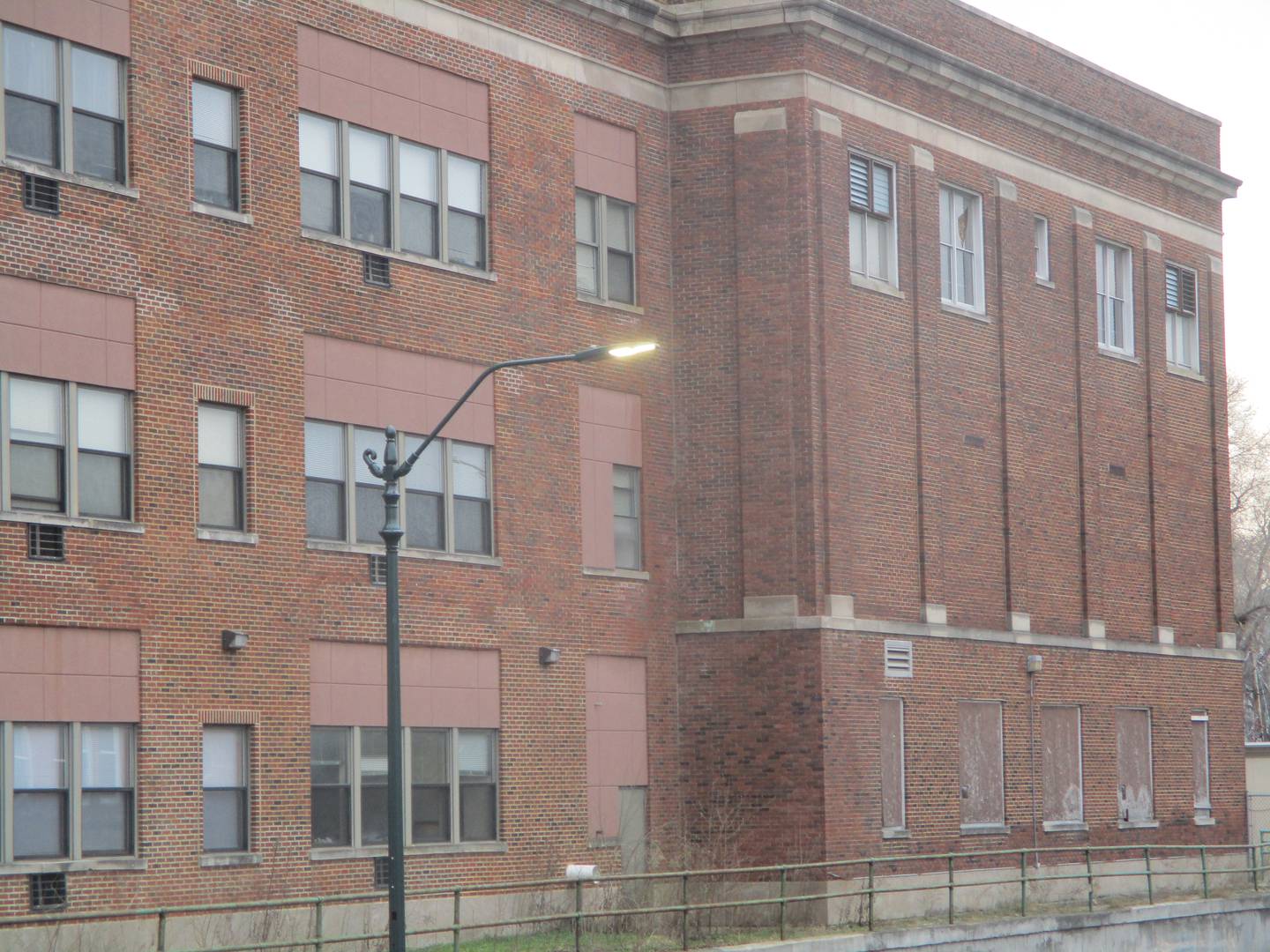 The gym and cafeteria of the old Joliet Catholic High School juts outs from a section of the building that contains senior residences at the Victory Centre of Joliet. March 13, 2024.