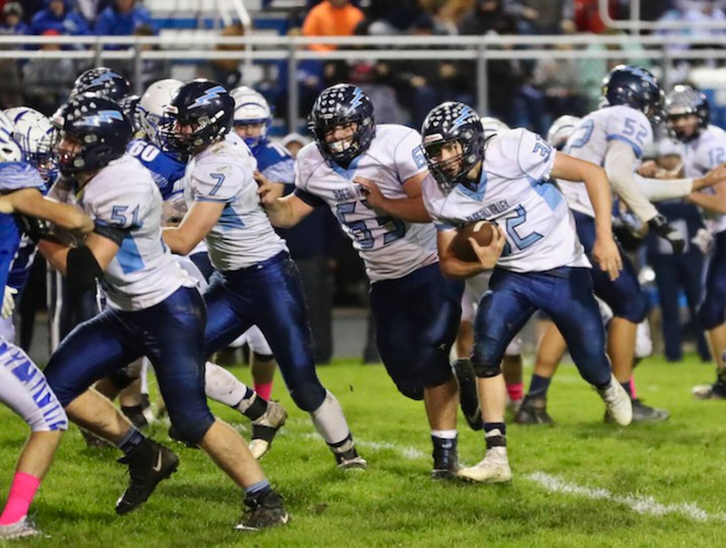 Bureau Valley's Jaden Michlig gets a convoy of blockers Carter Haney (51), Nevin Bolin (7) and Elija Kruse (63) Friday night a Princeton.