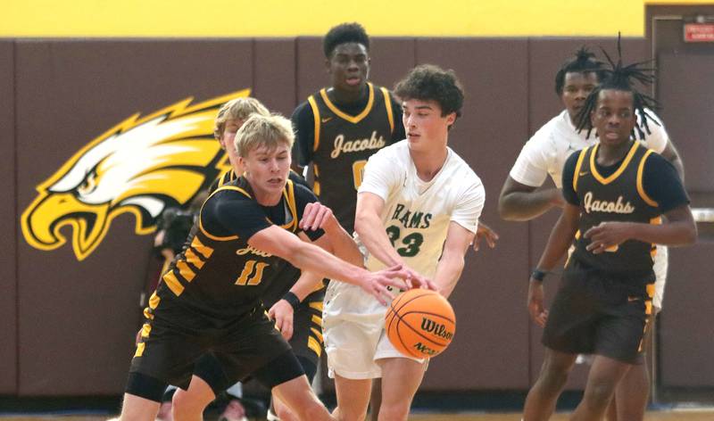 Jacobs’ Carson Goehring, left, steals the ball from Grayslake Central’s Aidan Bechard in varsity boys basketball Hinkle Holiday Classic action on Tuesday, Dec. 23, 2025, at Jacobs High School in Algonquin.