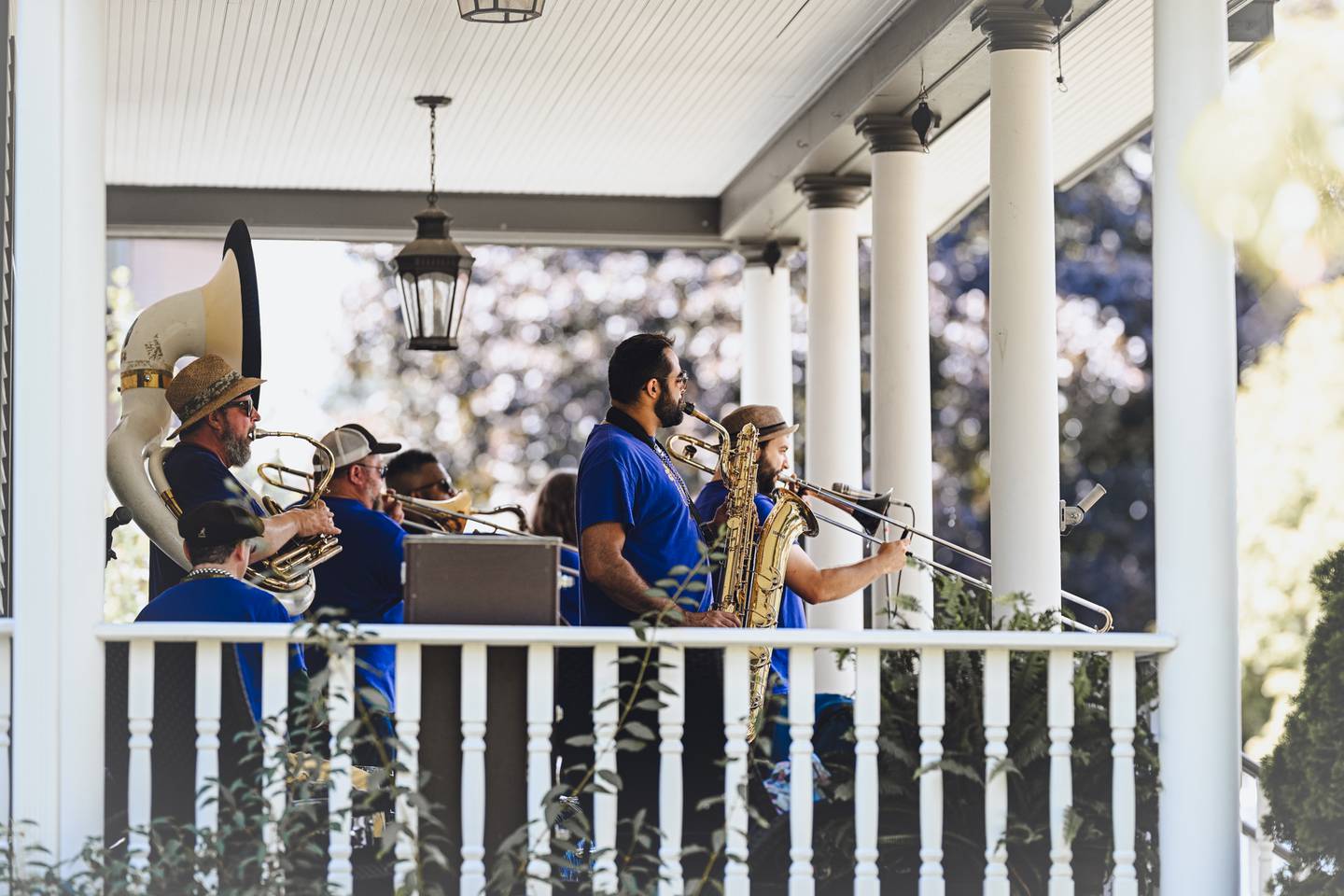 3rd City Brass Band performs on a Western Ave. porch at Porch & Park Music Fest 2024