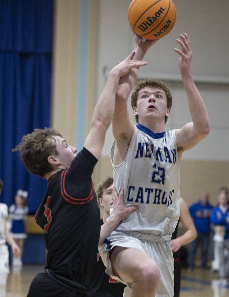 Newman’s John Rozwee puts up a shot against Erie-Prophetstown’s Max Milem Wednesday, Jan. 29, 2025, at Newman High School.