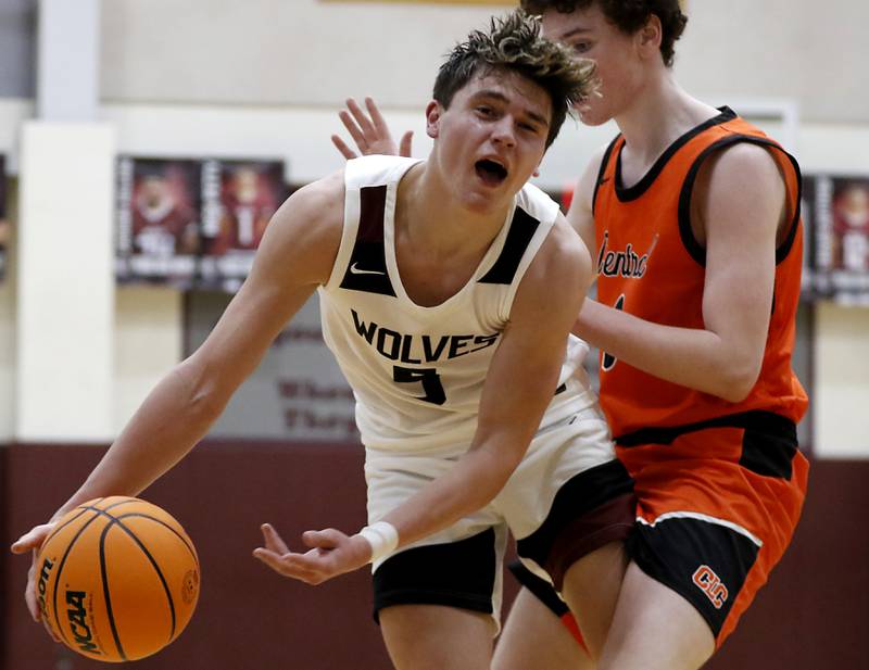 Crystal Lake Central's Danny Spychala fouls Prairie Ridge's Elijah Loeding during an IHSA Class 3A Prairie Ridge Regional basketball game on Monday, Feb. 24, 2025, at Prairie Ridge High School.