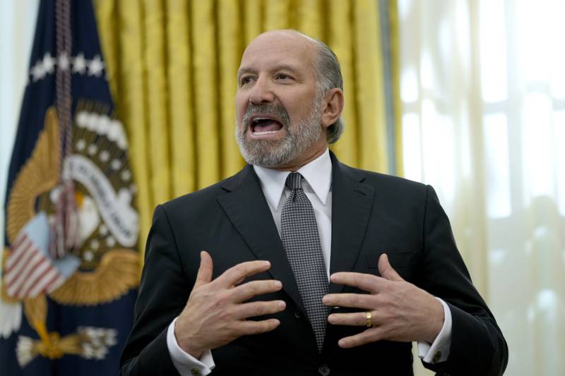 Commerce Secretary nominee Howard Lutnick speaks in the Oval Office of the White House after President Donald Trump signed an executive order, Thursday, Feb. 13, 2025, in Washington. (AP Photo/Ben Curtis)
