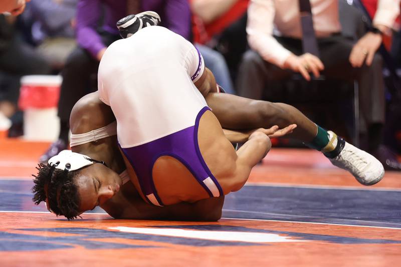 Joliet Catholic’s Gylon Sims Rochelle’s Xavier Villalobos in the Class 2A 113lb. championship match at State Farm Center in Champaign. Saturday, Feb. 19, 2022, in Champaign.