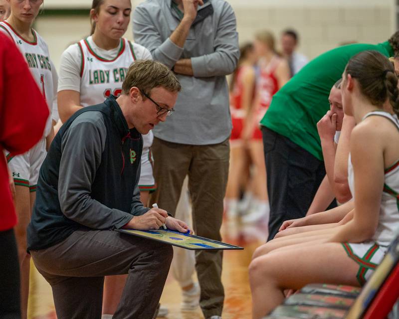 LaSalle-Peru Girls Basketball Head Coach, Adam Spencer draws up play during full-timeout on Wednesday, December 17, 2025 at Sellet Gymnasium in LaSalle.