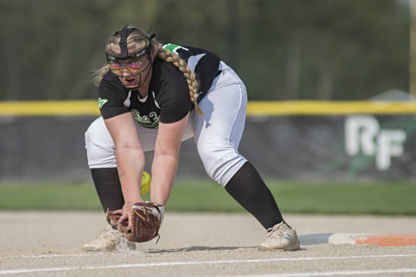 Rock Falls' Abby Whiles juggles a grounder but gets the out against Dixon on May 10, 2022.