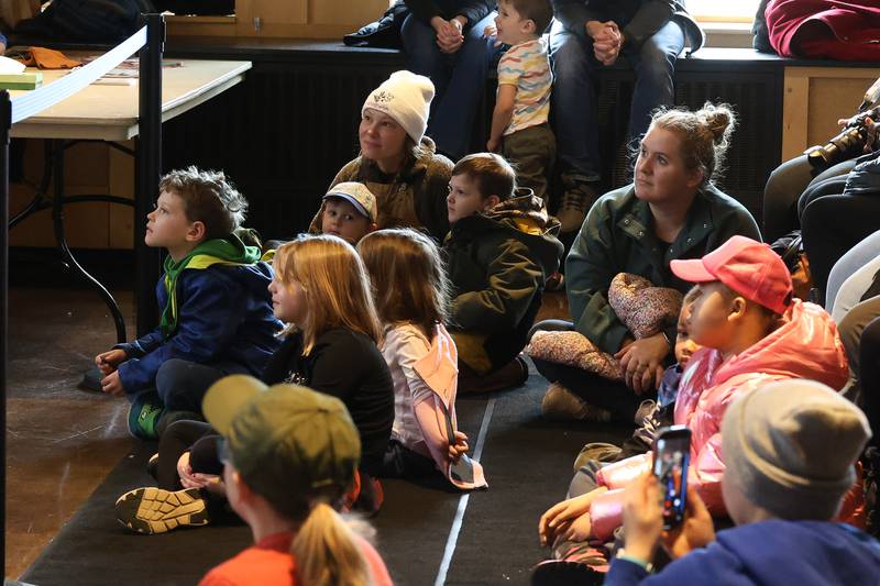 Several families sit front row for a live bird presentation by Hoo Haven volunteers at Four Rivers Environmental Education Center’s annual Eagle Watch on Saturday, Jan 10, 2026 in Channahon.