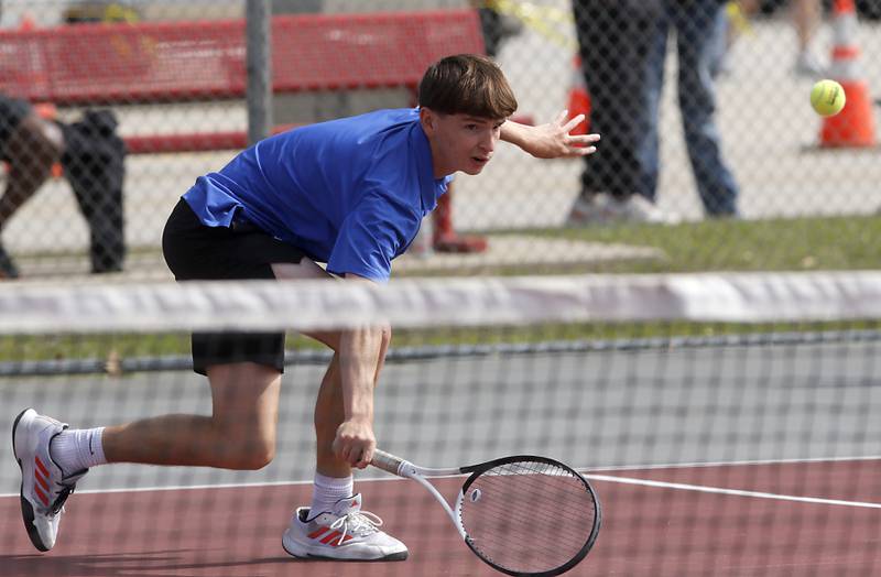 Lincoln-Way East’s Sam Cooley returns the ball as he and his doubles partner, Quinn Paris, compete in the Class 2A Boys State Tennis Tournament on Thursday, May 29, 2025, at Palatine High School.