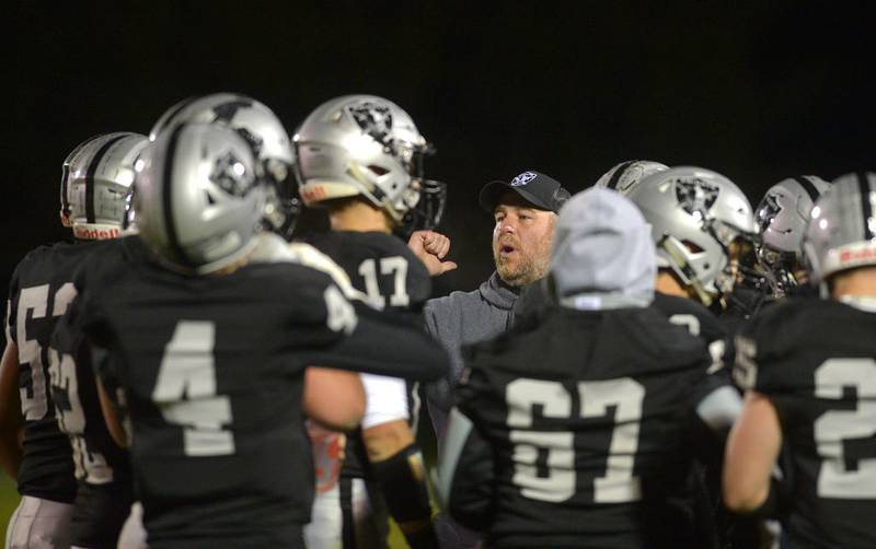 Kaneland head coach Pat Ryan huddles with the Knights during a second-quarter timeout in their Interstate Eight game against LaSalle-Peru Oct. 25 in Maple Park.
