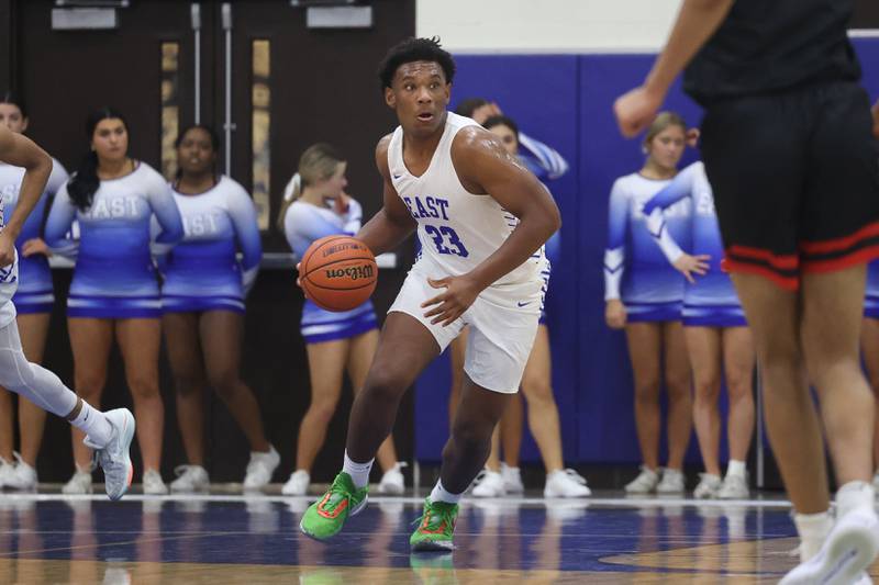 Lincoln-Way East’s Jacob Alexander looks to pass after the rebound against Bolingbrook on Tuesday, Dec.12th, 2023 in Frankfort.