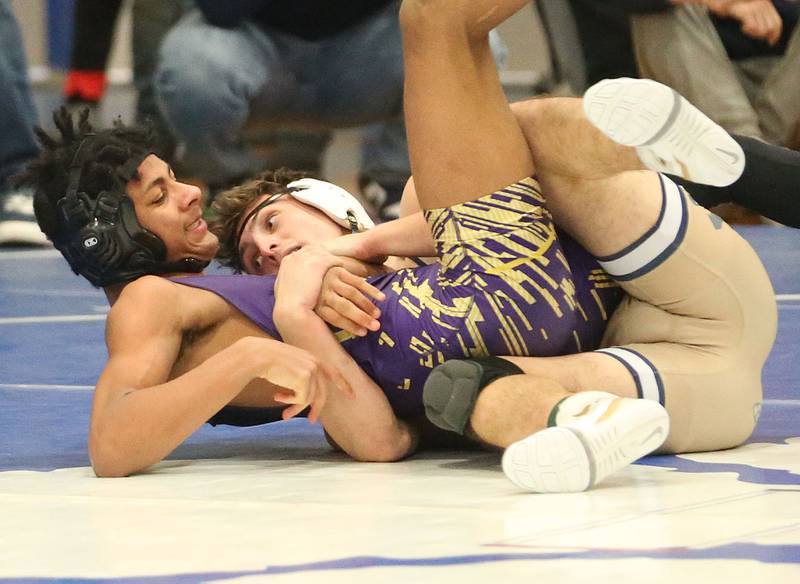 Mendota's Travon Rucker wrestles Marquette's Beau Thompson during the Class 1A Regional meet on Saturday, Jan. 31, 2026 at Princeton High School.