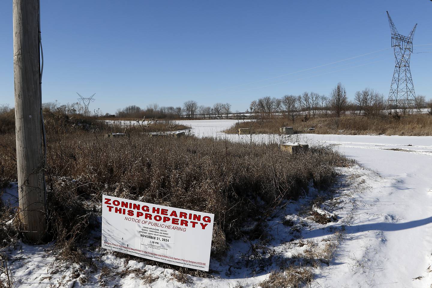 McHenry County officials are reviewing a proposal to renew a conditional use permit for Maple Valley Materials to operate a gravel pit and a ready mix facility at a farm field near Marengo.