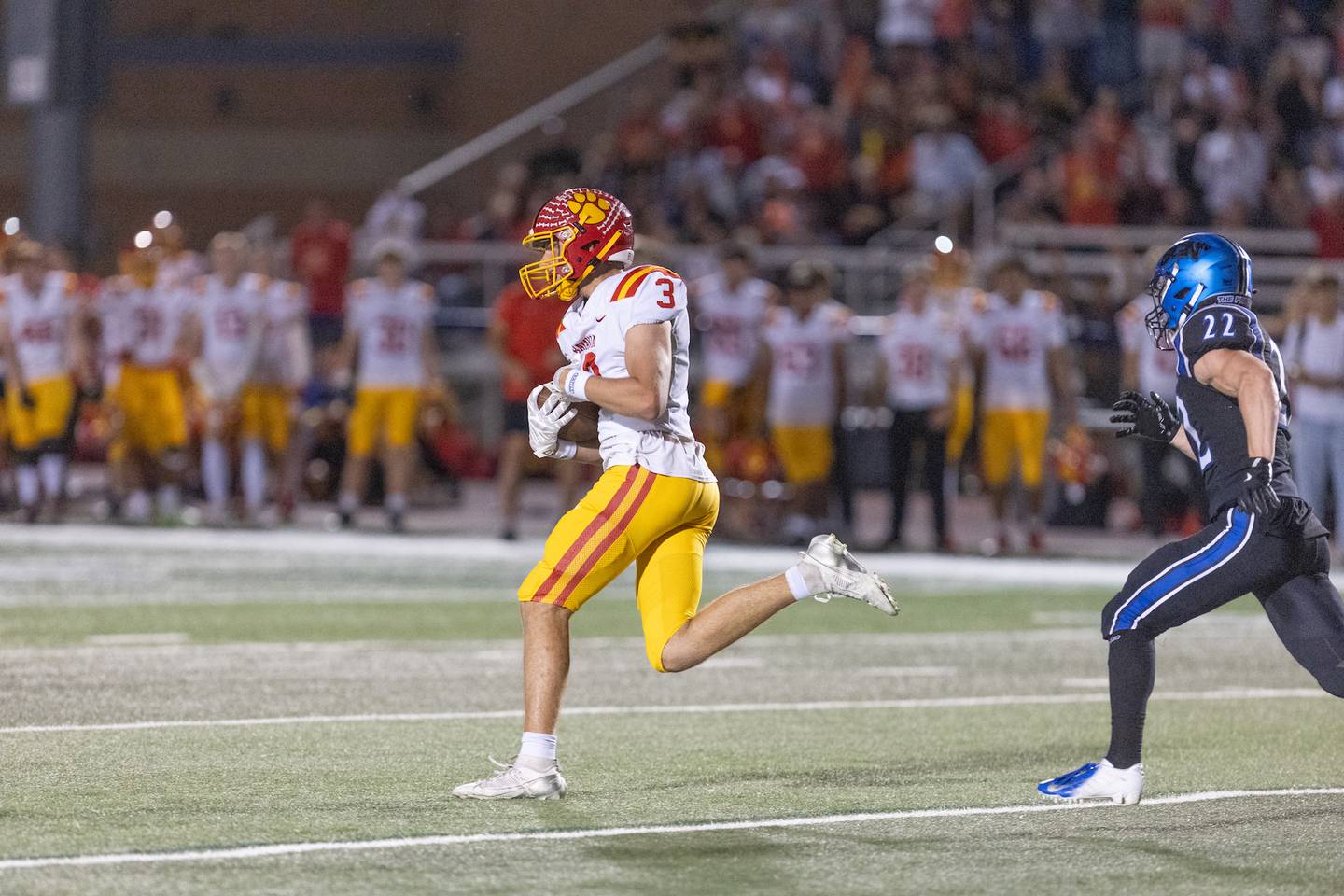 Batavia's Thomas Prescott makes the running catch past St. Charles North's Josh Wilkerson on Friday, Sept. 26, 2025 in St. Charles.