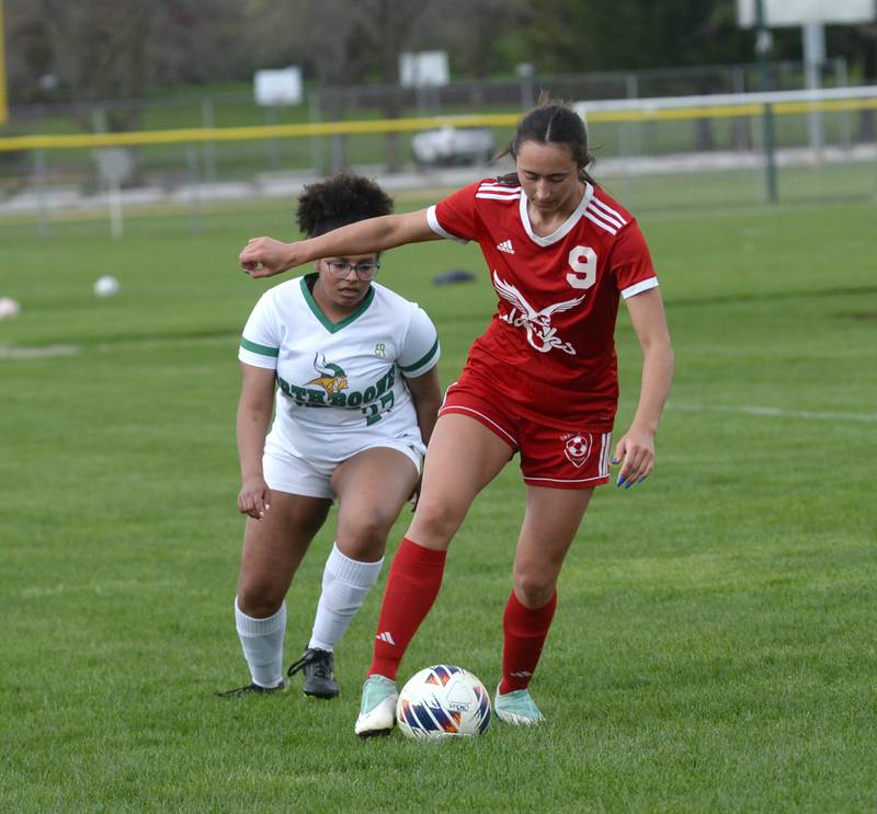 Oregon's Kenna Wubbena (9) battles a North Boone player for the ball during a Tuesday, April 23, 2024 game at Oregon Park West.