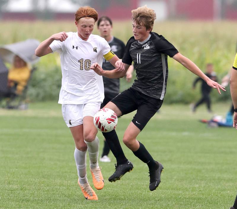 Sycamore's Jameson Carl (left) and Kaneland's Matthew Mitchinson go after a loose ball during their game Wednesday, Sept. 6, 2023, at Kaneland High School in Maple Park.