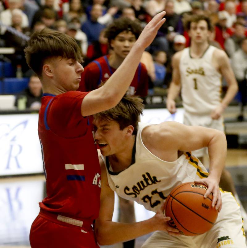Crystal Lake South's Cooper LePage drives the lane against Marmion’s Collin Wainscott during a IHSA Class 3A Sectional boys basketball game Tuesday, Feb. 28, 2023, at Central High School in Burlington.