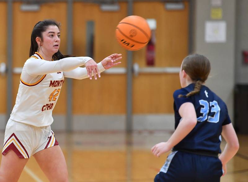Montini’s Natalie Gartlan (42) sends a pass past Nazareth’s Molly Moore during a Coach Kipp Hoopsfest game on January 20, 2025 at Benet Academy in Lisle.