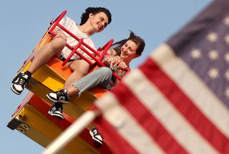 Gavin Hardt, of Belvidere, and Shea Tomlinson, of Genoa, enjoy one of the rides during Genoa Days, Wednesday, June 7, 2023, in downtown Genoa. The festival continues through Saturday.