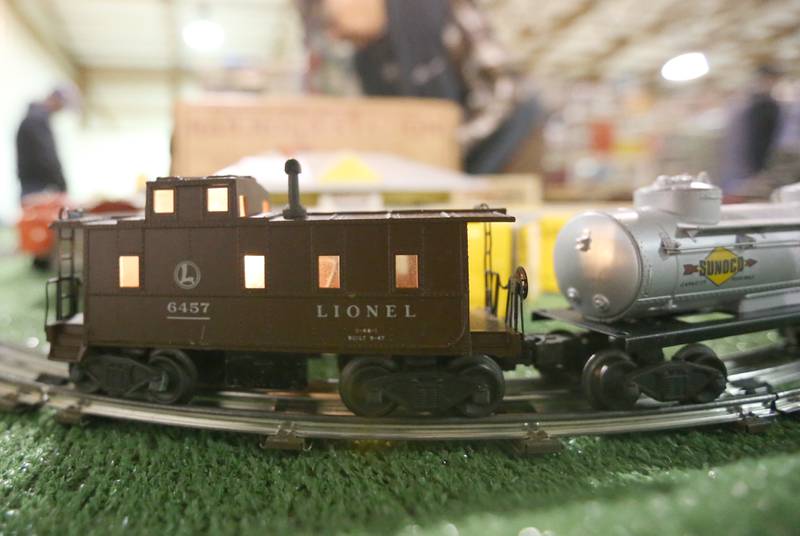 An Lionel O Scale caboose runs around a display during the Model Train Fair and Farm Toy Show on Saturday, Feb. 17, 2024 at the Bureau County Fairgrounds in Princeton.