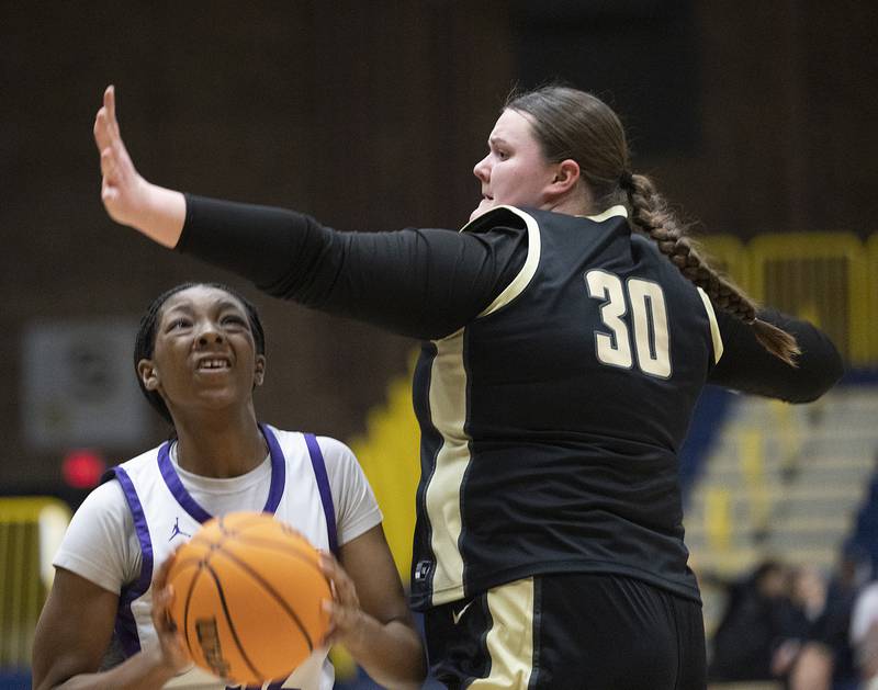 Plano’s Nylah Mathews works against Sycamore’s Kennah Butler Monday, Feb. 17, 2025, during a 3A semifinal in Sterling.