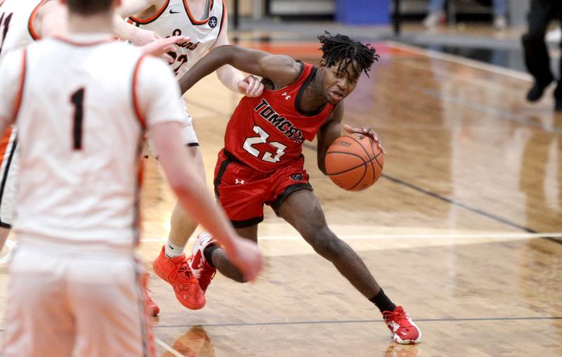 East Aurora’s Luis Umana (23) drives toward the basket during a game against St. Charles East in the 63rd Annual Ron Johnson Thanksgiving Tournament at St. Charles East on Monday, Nov. 21, 2022.