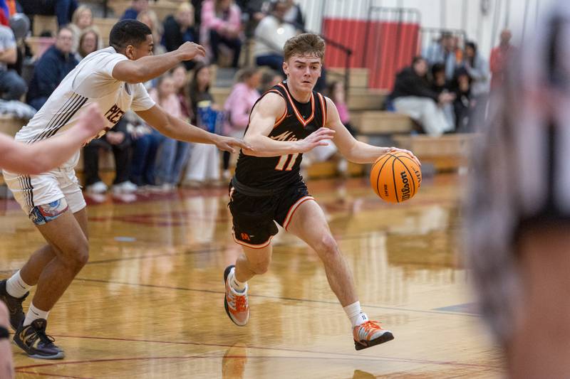 Minooka's Brady Hairald drives the lane against Yorkville on Thursday, Jan.22,2026 in Yorkville.