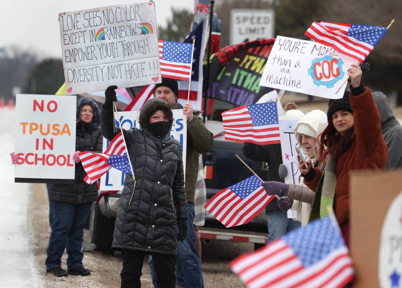 A gathering protests Thursday, Feb. 5, 2026, in front of Genoa-Kingston High School. The group is protesting the “History Rocks” assembly which is part of a nationwide campaign by the U.S Department of Education tied to the nation’s 250th anniversary and organized by the high school’s Turning Point USA, Club America chapter, a nonprofit founded in 2012 by the late Charlie Kirk.