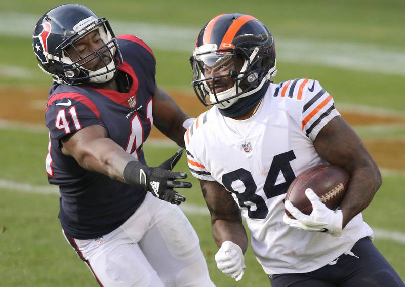Chicago Bears wide receiver Cordarrelle Patterson (84) eludes the tackle of Houston Texans inside linebacker Zach Cunningham (41) during their game Sunday at Soldier Field in Chicago.