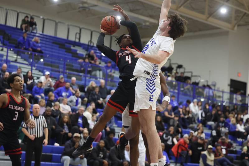 Bolingbrook’s KJ Cathey takes the contested shot against Lincoln-Way East on Tuesday, Dec.12th, 2023 in Frankfort.