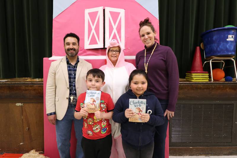 Pictured: (back row L to R) M.J. Cunningham Elementary School Principal Luis Gonzalez, English Language Arts Instructional Coach Nicole Gans, Assistant Principal Katie Kikos and (front row L to R) third-grade students Manuel Cerrillo and Adelyn Aguilera at the school’s kick-off assembly for the book Charlotte’s Web.