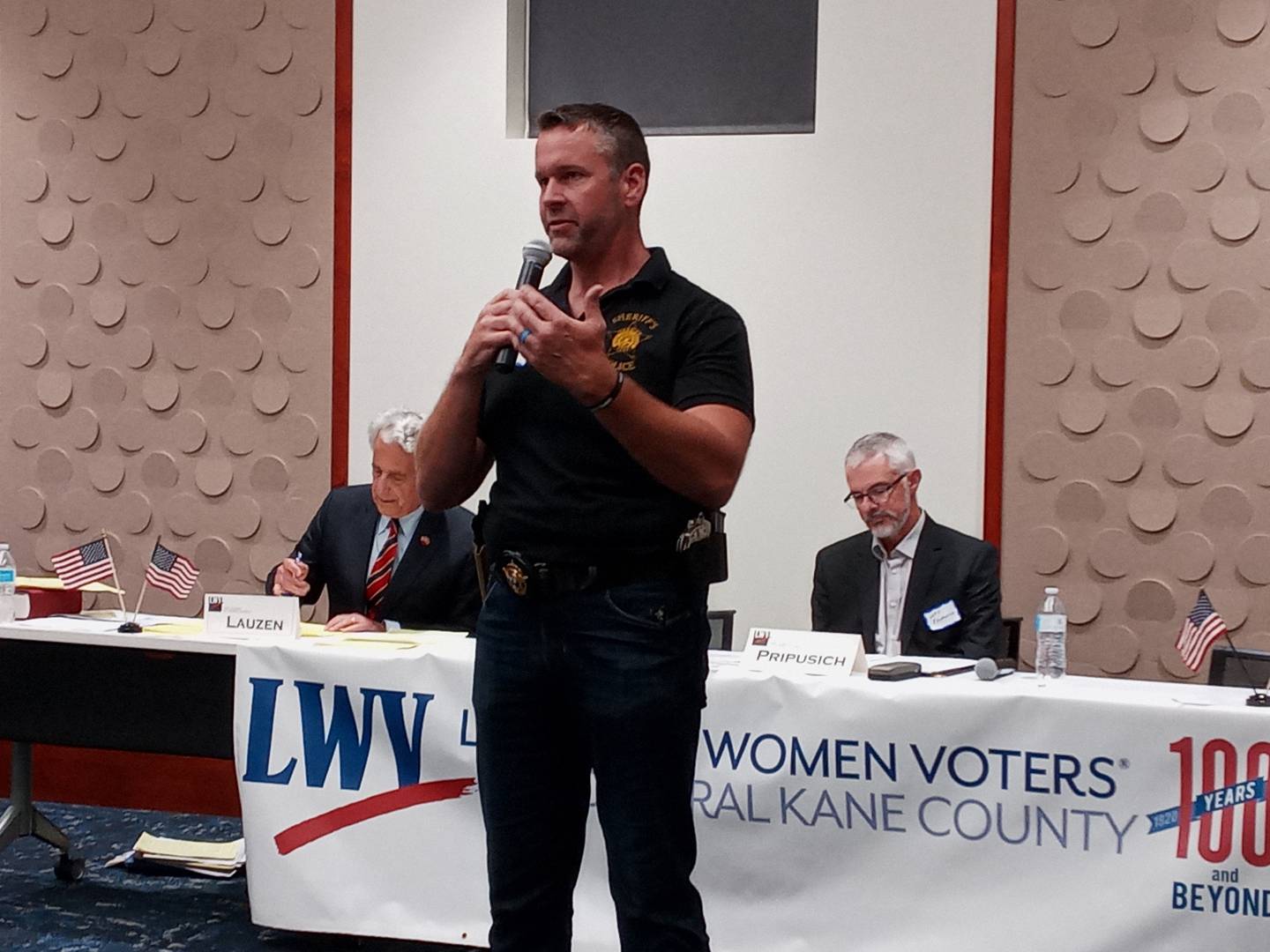 Democrat incumbent Sheriff Ron Hain presents his 2-minute platform for re-election at a League of Women Voters of Central Kane County candidate forum Sept. 27. Because his opponent in the Nov. 8 general election did not attend, Hain could not answer questions, per League rules.