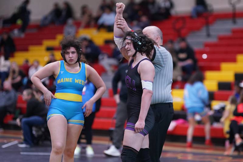 Downers Grove North’s Kayleigh Loo (right) smiles after wining her 170 pound championship match against Maine West’s Lillian Garrett in the Schaumburg Girls Wrestling Sectional at Schaumburg High School on Saturday, Feb 10, 2024.