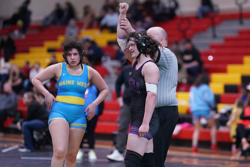 Downers Grove North’s Kayleigh Loo (right) smiles after wining her 170 pound championship match against Maine West’s Lillian Garrett in the Schaumburg Girls Wrestling Sectional at Schaumburg High School on Saturday, Feb 10, 2024.