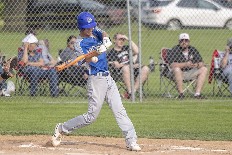Newman’s Kyle Wolfe drives the ball to right field to drive in a run against Amboy Thursday, May 18, 2023.