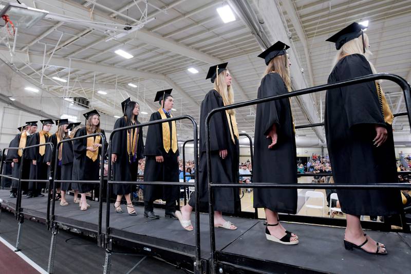 Graduates process up to receive their diplomas during the 2024 Sycamore High School commencement in Sycamore on Sunday, May 26, 2024.