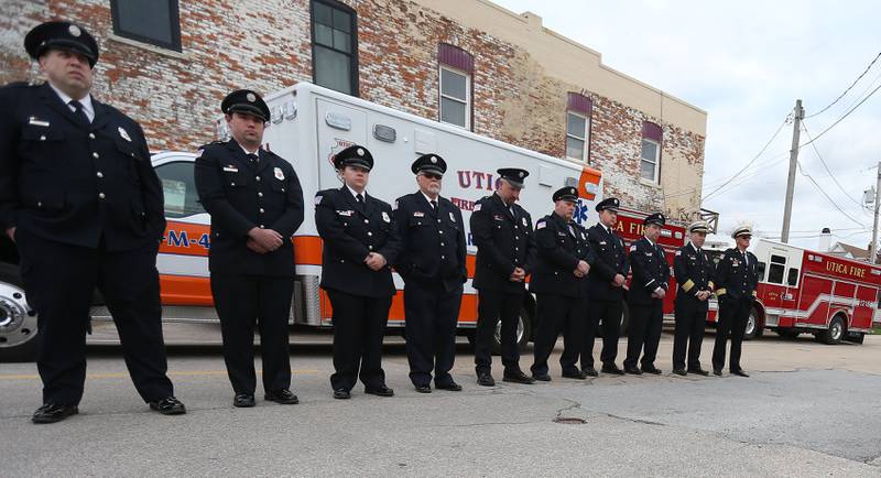 Utica Fire Department personnel pay respects to the eight people who perished during the 20th anniversary of the tornado at the memorial on Saturday, April 20, 2024 in Utica.