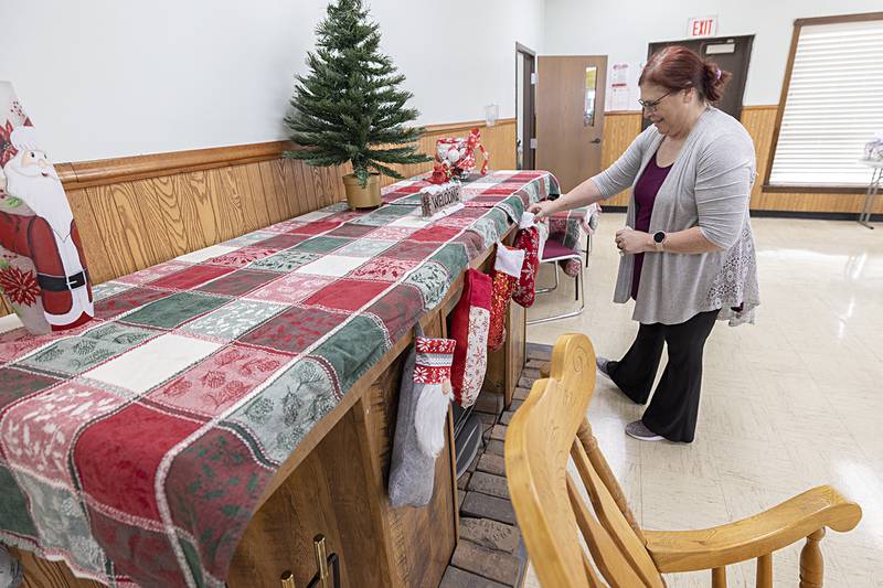 Stacey Sturgeon prepares an area where Santa will make an appearance during the Santa's Secret Workshop at Rock River Valley Self Help Enterprises. Cookies will be provided.