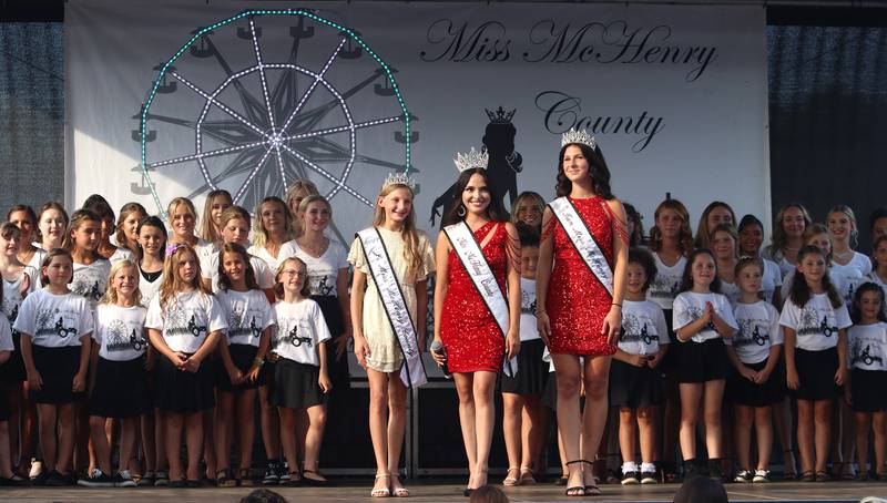 Reigning 2023 queens lead 2024 contestants as part of their pageant at the McHenry County Fair in Woodstock on Tuesday, July 30, 2024.