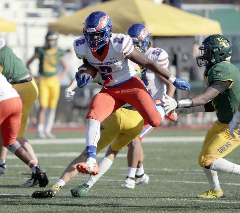 Hoffman Estates' Quincey WilliamÕs, 2, leaps his way into the red zone Saturday October 29, 2022 in Elk Grove Village.