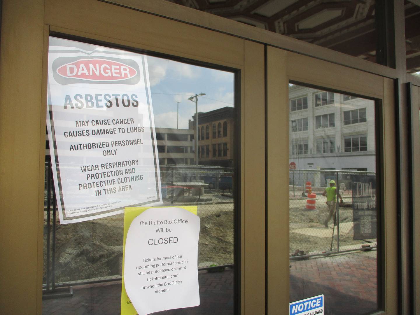 A notice posted on the front entrance to the Rialto Square Theatre building in downtown Joliet gives notice of an asbestos inspection that has been in process since late July. Aug. 29, 2024