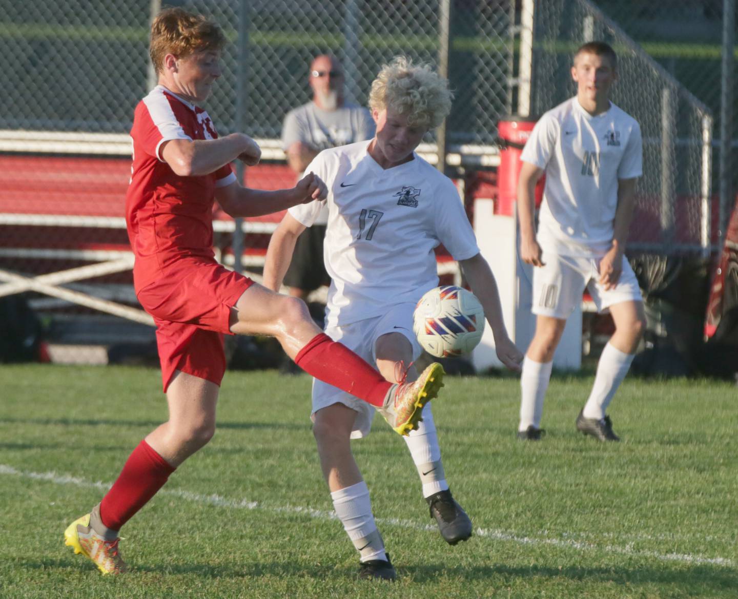 Ottawa's Evan Snook (23) kicks the ball away from Kaneland's Sam Keen (17) on Wednesday Sept. 7, 2022 in Ottawa.