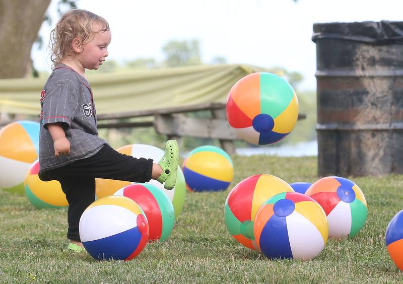 Theo Benckendork 2, of Marseilles, kicks a beach ball while having fun during Marseilles Fun Days on Tuesday, June 24, 2025 at the Marseilles Community Boat Launch. The festival featured Jimmy Buffett themed music, kids games and a ducky derby. Marseilles Fun Days runs through Sunday with different themed-nights.