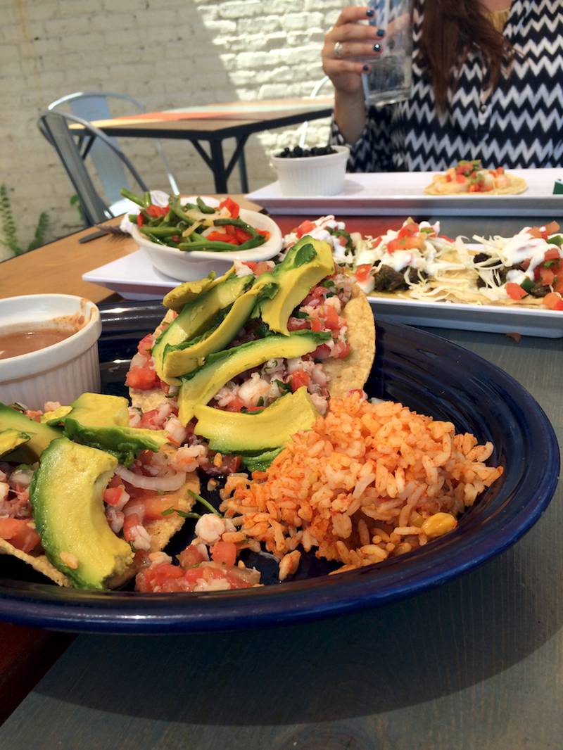 Shrimp and avocado tostadas (front) and steak chimichuir tacos at Sergio's Cantina on 30 W State St. in Geneva.