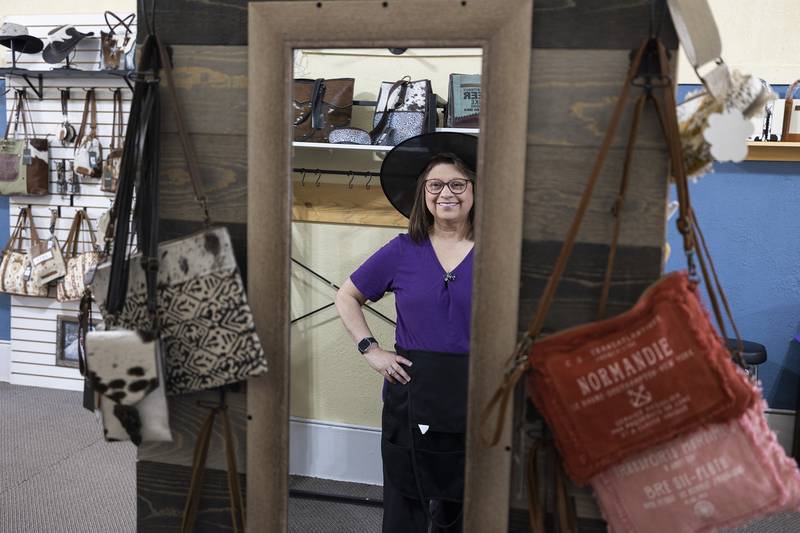 Norma Thompson, owner of Rustic Paw Studio in downtown Dixon, dons her witch hat Thursday, Oct. 16, 2025, during Witches Night Out. In celebration of the one night festival, Norma offered deals on items in the store.
