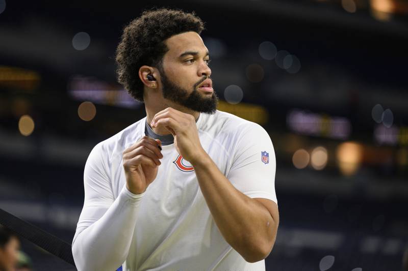 Chicago Bears quarterback Caleb Williams (18) warms up on the field before an NFL football game against the Indianapolis Colts, Sunday, Sept. 22, 2024, in Indianapolis. (AP Photo/Zach Bolinger)