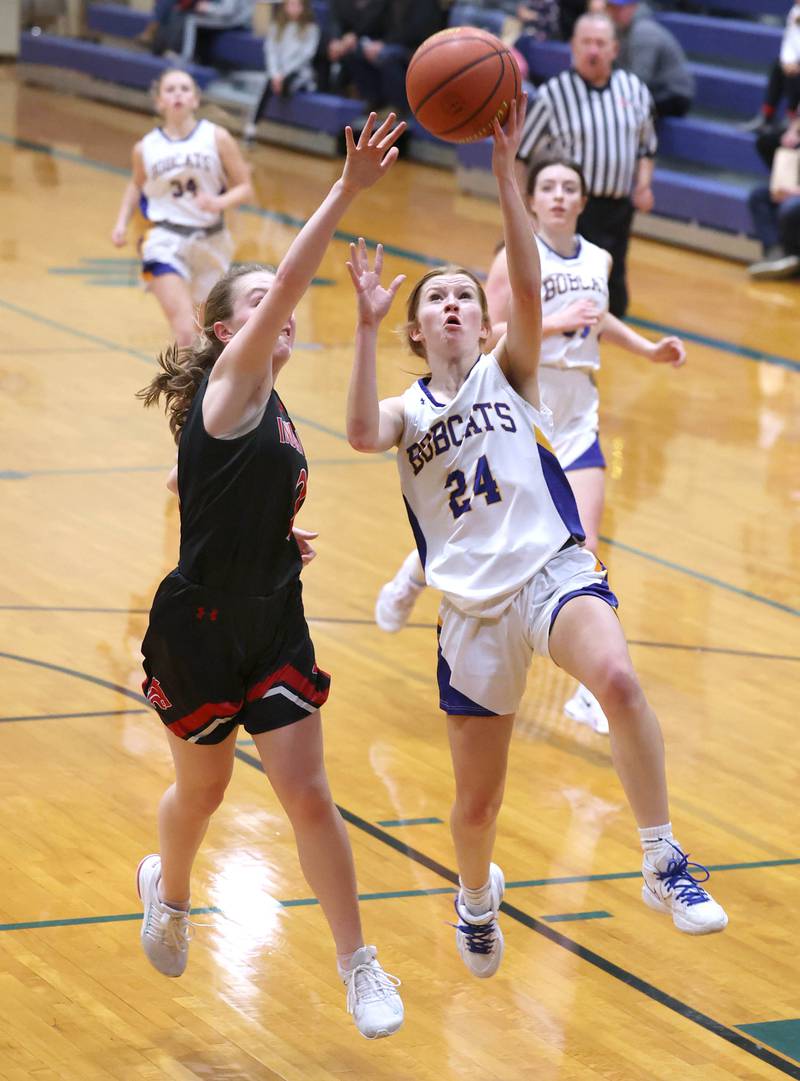 Somonauk's Katelyn Curtis gets a layup in front of Indian Creek's Bethany Odle during their game Monday, Jan. 9, 2023, at Somonauk High School.