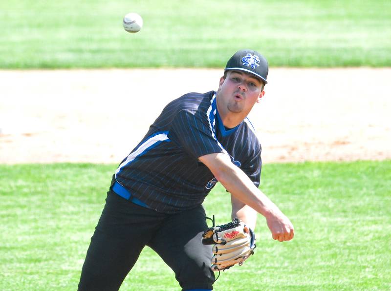 Newman's Ethan VanLanduit hurls a pitch to the plate during the supersectional game against Marquette at Rockford Rivets Stadium