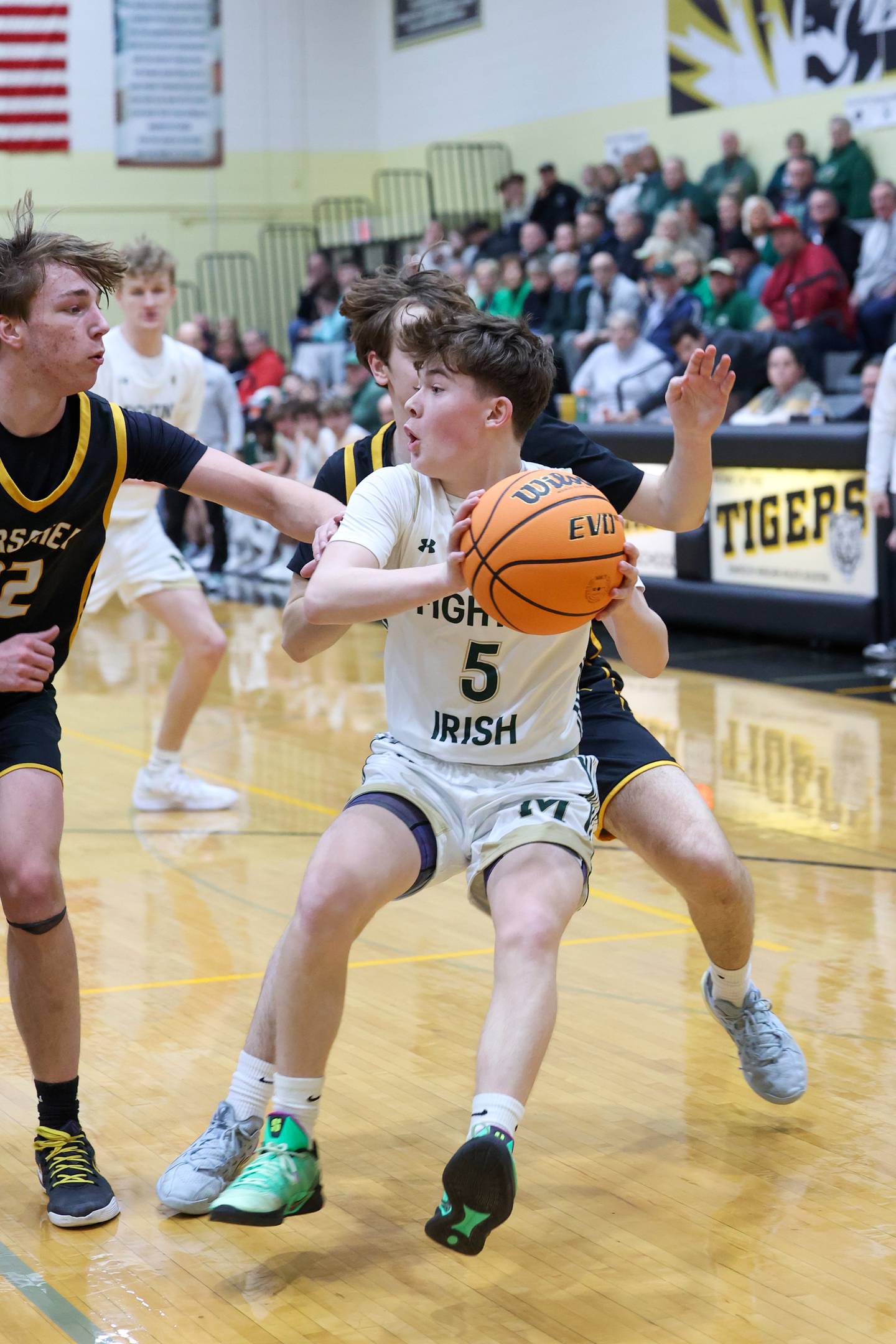 Bishop McNamara's Jayson Benton approaches the lane under pressure during Bishop McNamara's 71-42 victory over Herscher in the IHSA Class 2A Herscher Regional semifinal on Wednesday, Feb. 25, 2026.