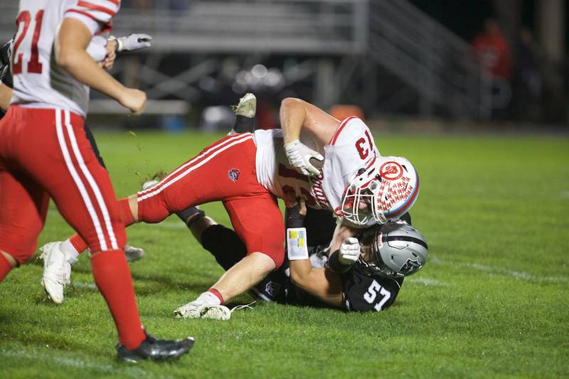 Ottawa's Ethan Poutre is tackled by Kaneland's Jackson Slifka on Friday, Sept. 19, 2025 in Maple Park.
