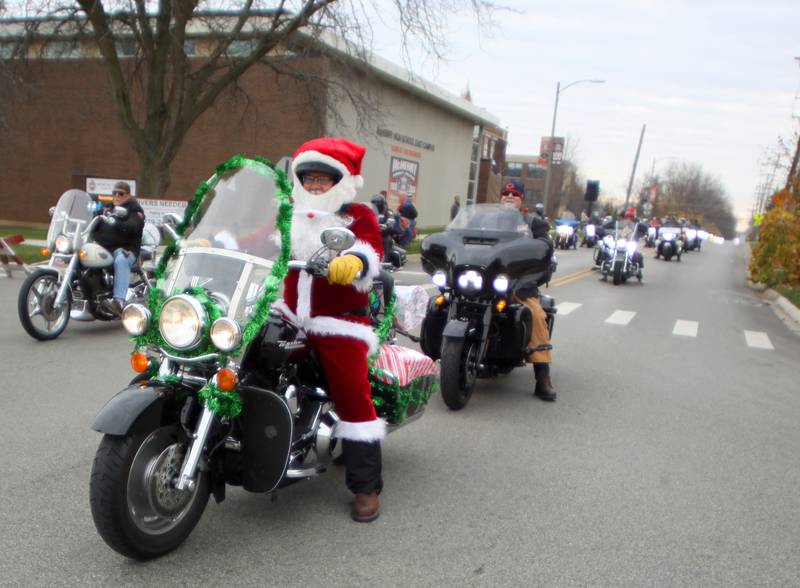 Motorcyclists cruise during the Toys for Tots Parade on Sunday, Nov. 24, 2024, in downtown McHenry.
